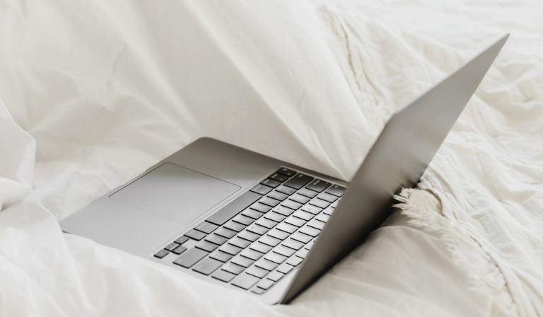 computer on bed with Smart Tips That Will Change The Way You Study_