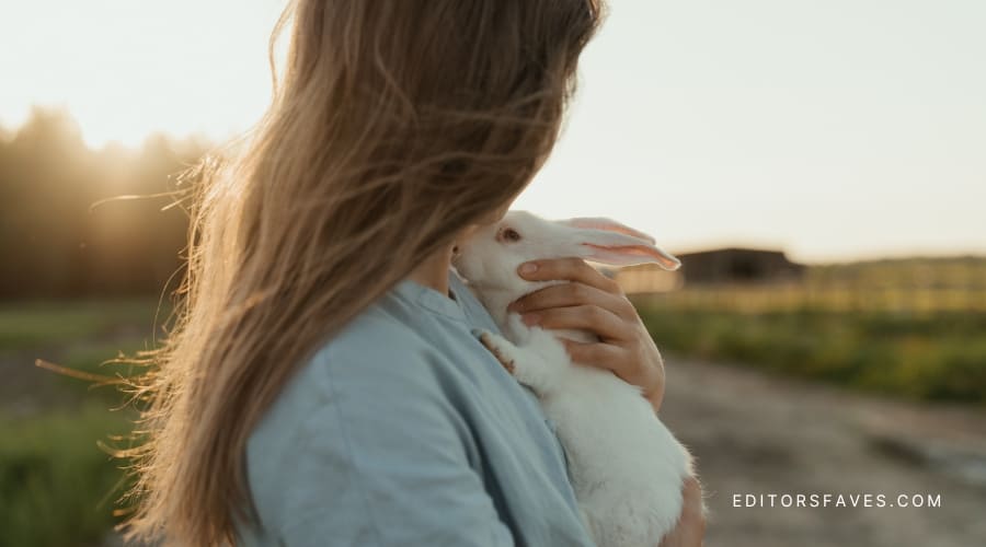 woman holding white bunny learning How to Do the Alice in Wonderland Shifting Method in 5 Steps