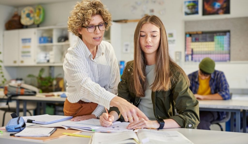 teacher helps student learn 7 Lessons For Academic Success In High School