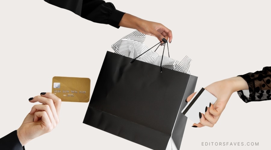 woman handing shopping bag to shoppers black friday deals from eco-friendly brands