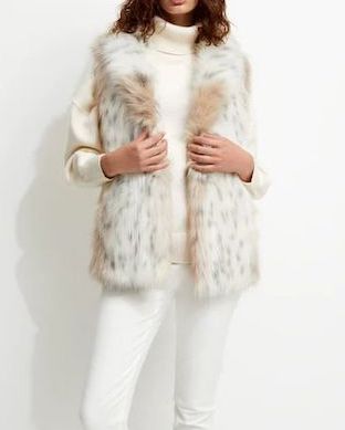 woman modelling a faux fur coat designed by unreal fur. does unreal fur have a black friday sale?
