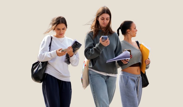 three students walk to class learning tips for your first year at college
