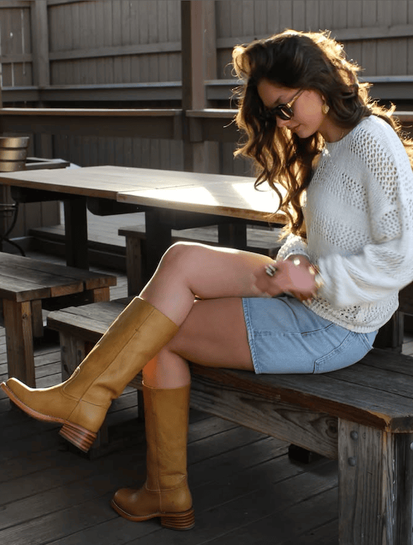 woman wearing campus banana boots with jean shorts fall shoe trends