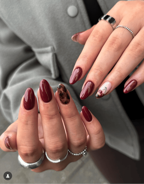 editorial dark cherry red nails with tortoise shell