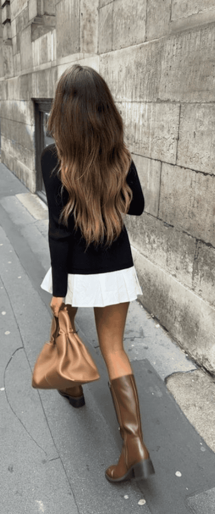 woman wearing stylish fall boots in style this year