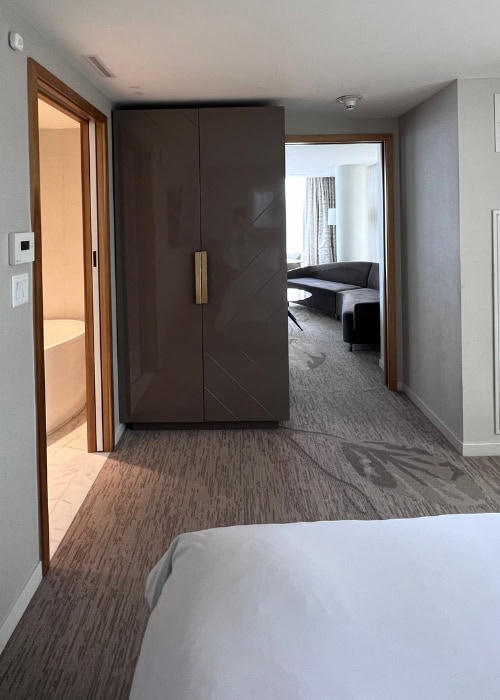 Luxury hotel room at JW Parq Vancouver with modern design and cozy seating area.